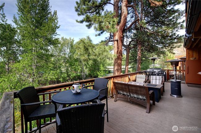 The lodge has extensive decking with many seating areas to accommodate you and your guests. | Image 8