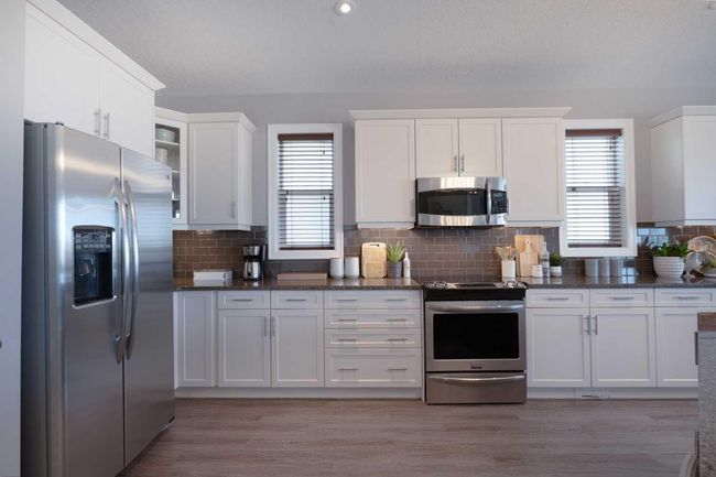 64 Windgate Close Sw, House other with 4 bedrooms, 3 bathrooms and 4 parking in Airdrie AB | Image 4