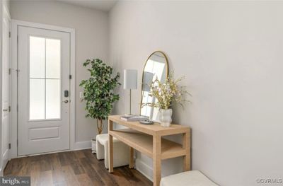 Doorway with dark wood-type flooring | Image 3