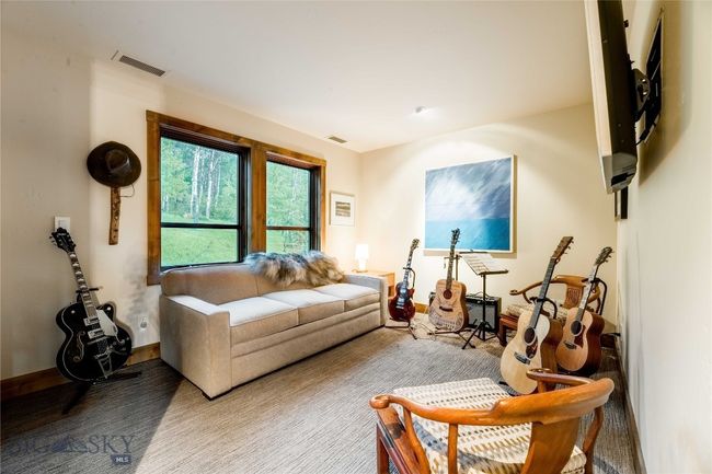 Upper level guest bedroom with aspen grove views. | Image 40