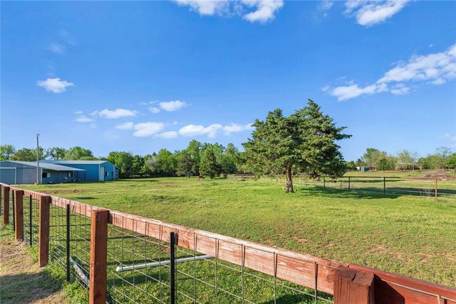 View of yard featuring fence and a rural view | Image 5
