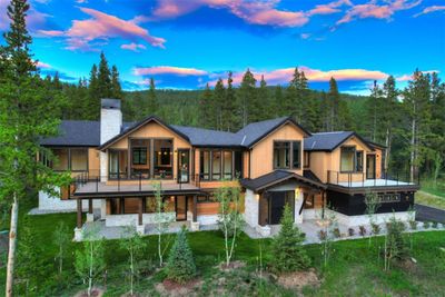 Back house at dusk with a balcony | Image 1