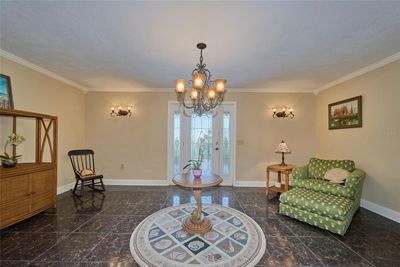 Living room with view of front door entrance | Image 3