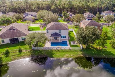 On a premier **.21 ACRE POND LOT** in Deland’s Saddlebrook community this spacious 5-bedroom, 3-full and 1-half bath home is outside of the hustle and bustle of Orlando while still being close to every convenience. | Image 2