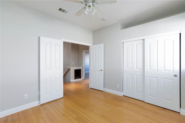 Unfurnished bedroom featuring visible vents, a closet, baseboards, ceiling fan, and light wood-style flooring | Image 34