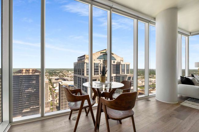 Dine in style from your perch above the city and enjoy a seamless flow between the kitchen, living, and dining areas. | Image 8