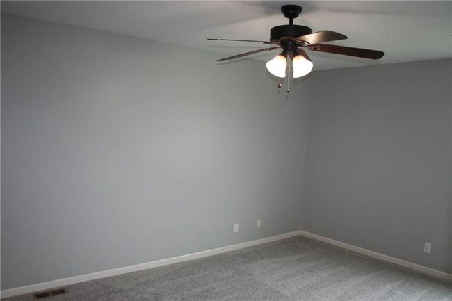 Unfurnished room with carpet and a ceiling fan | Image 10