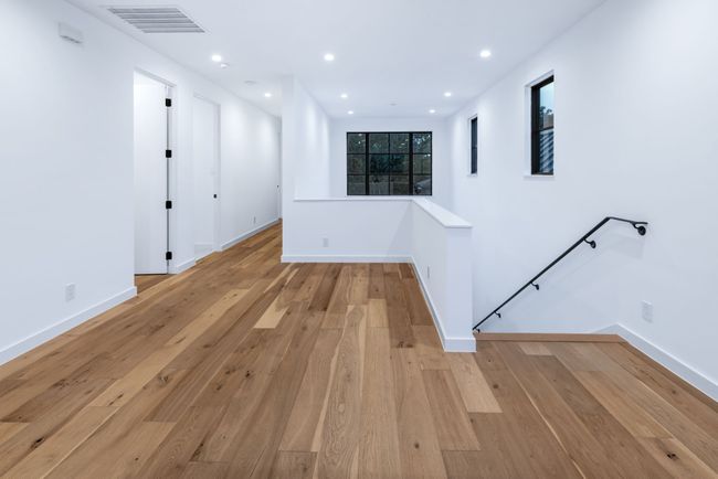 Empty room featuring light wood-style floors and recessed lighting | Image 23