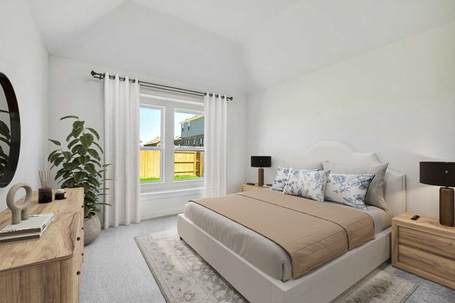 Carpeted bedroom featuring lofted ceiling and baseboards | Image 5
