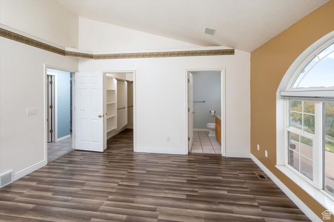 Interior space with vaulted ceiling and dark hardwood / wood-style floors | Image 17