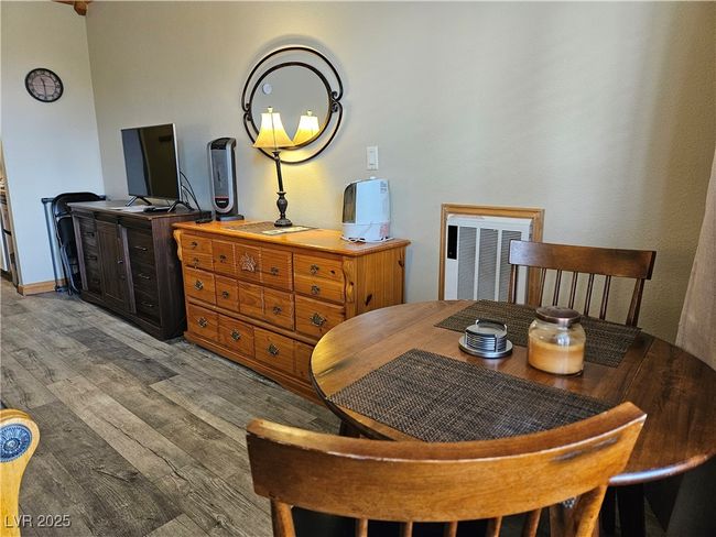 Dining room with wood finished floors | Image 12