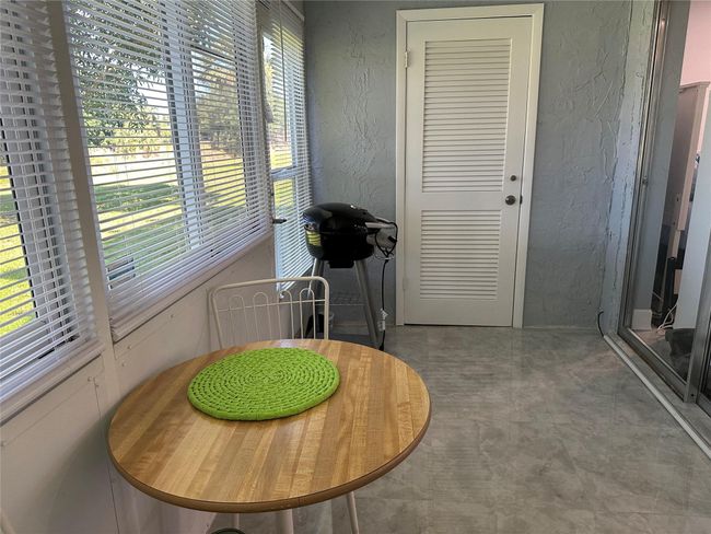 Glass enclosed patio with storage closet | Image 18