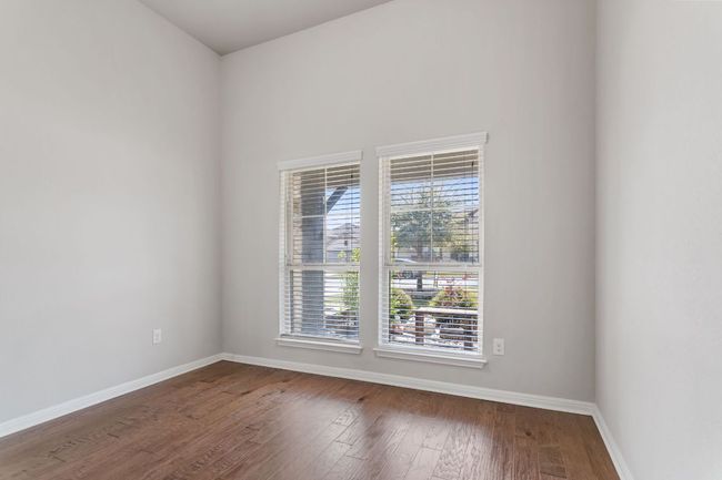 Dining featuring baseboards and wood finished floors | Image 10