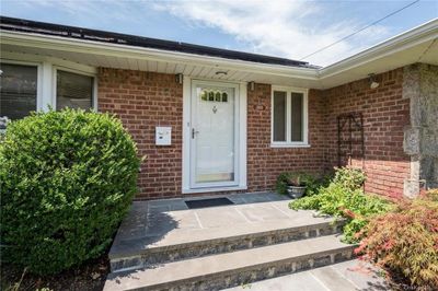 Doorway to property with a patio area | Image 3