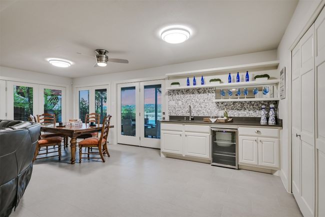 This secondary living space offers the perfect space for entertaining or a guest quarters with its own living dining and kitchen area | Image 14
