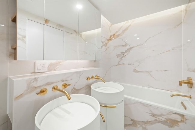 Bathroom featuring vanity and a combined bath / shower with marble appearance | Image 10