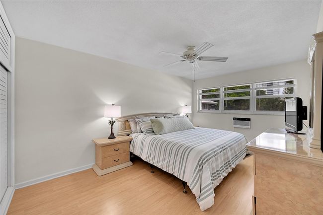 Your Furnished Primary Bedroom has more than Enough Room which Includes This King Sized Bedroom Furniture and there is Still Room For a Seating, Reading or Desk Area! Includes Impact Windows & Blinds, So Peaceful! | Image 7