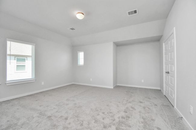 Secondary bedroom features plush carpeting, large windows that let in plenty of natural light, bright paint, and spacious closets. | Image 37