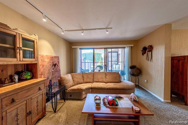 Living area with track lighting and light carpet | Image 12