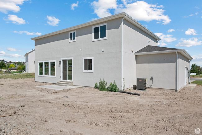 Back of house featuring entry steps and stucco siding | Image 31