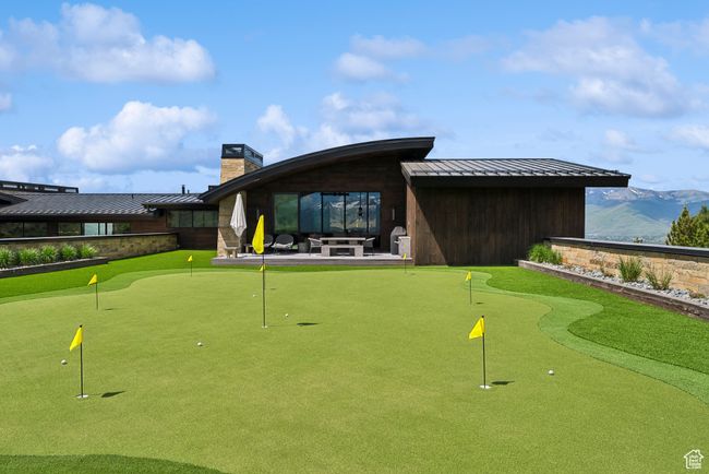 View of home's community with a putting green, a patio area, and a mountain view | Image 120