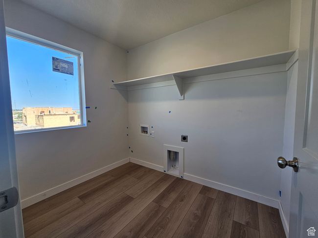 Laundry room with hookup for an electric dryer, dark wood finished floors, hookup for a gas dryer, and washer hookup | Image 15