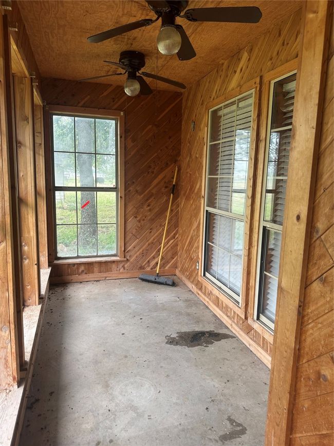 View of unfurnished sunroom | Image 13