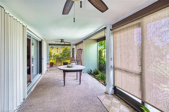 Sunroom with a ceiling fan and plenty of natural light | Image 21