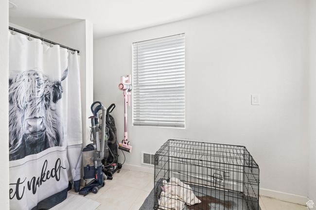 Tiled bedroom with baseboards | Image 19