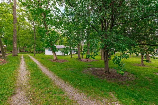 The corner lot and circle drive make it an easy in and out for this home. | Image 7