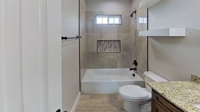 Full bath with toilet, shower combination, and vanity | Image 14