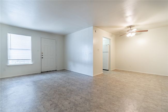 Empty room featuring ceiling fan and baseboards | Image 5