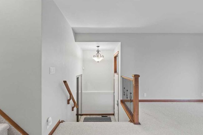 76 Coach Gate Way Sw, House other with 3 bedrooms, 2 bathrooms and 4 parking in Calgary AB | Image 5