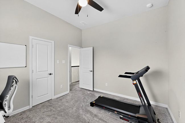 Workout area with carpet flooring and ceiling fan | Image 27