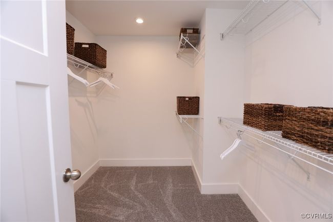 VIRTUAL STAGING. Photo represents the plan with virtual staging. Luxurious primary suite. | Image 25