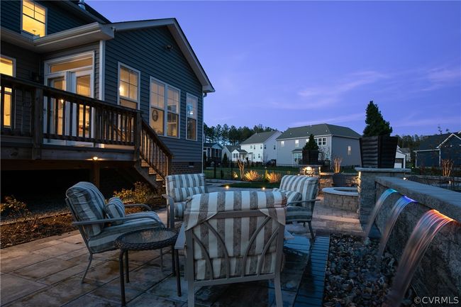 Patio terrace at dusk with an outdoor fire pit and a deck | Image 45