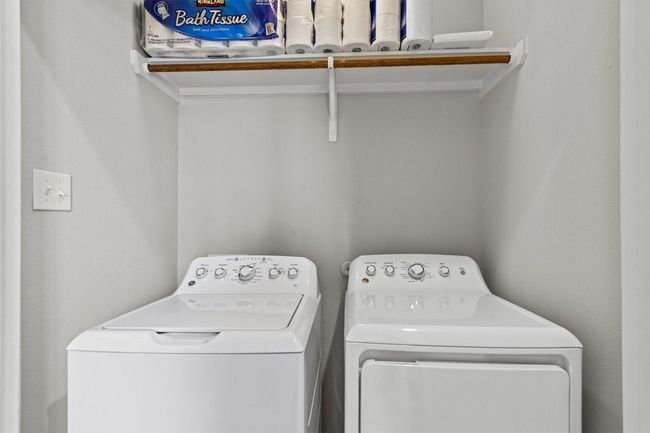 Washroom featuring washing machine and dryer | Image 13