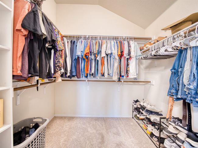 Walk in closet with carpet flooring and lofted ceiling | Image 13