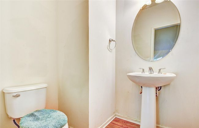 Bathroom with pedestal sink, toilet, hardwood floors | Image 12