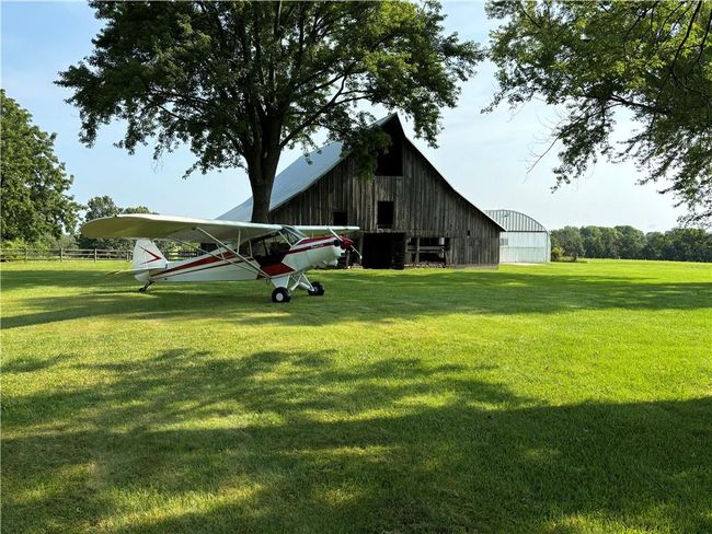 View of yard with an outbuilding | Image 51