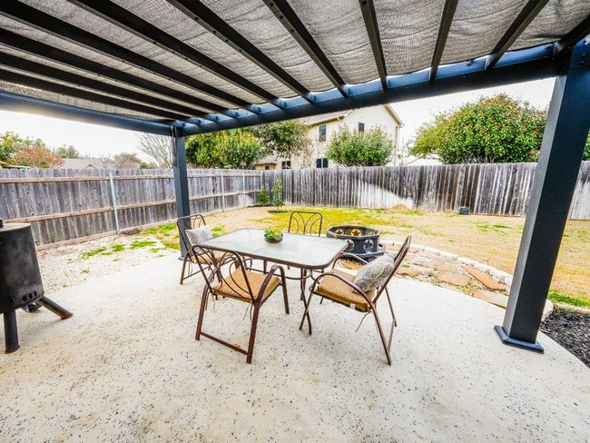 View of patio / terrace featuring outdoor dining area, a fenced backyard, and a pergola | Image 5