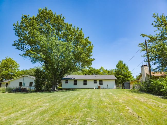 Back of property featuring an outbuilding and a storage shed | Image 27
