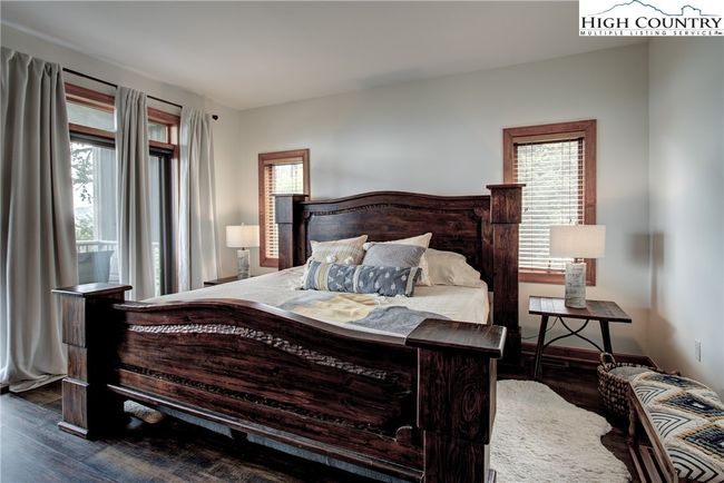 Love the primary suite with its windows and wall of sliding doors! | Image 27