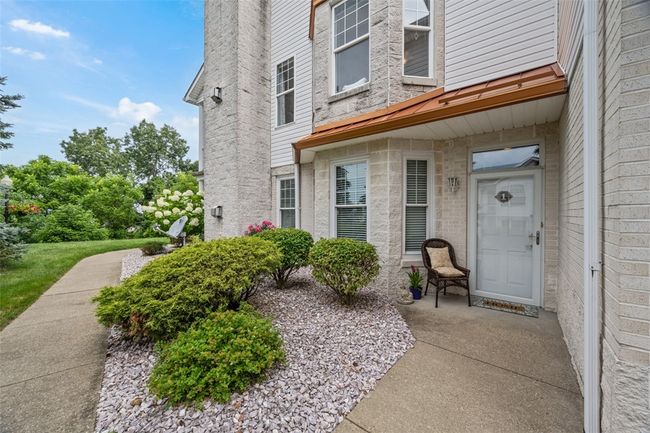 Lush landscaping surrounds this unit and you have amazing privacy as an end unit with tree lined view. | Image 6