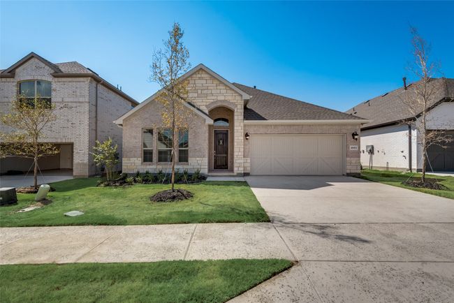 Traditional home with a 2 car garage and a front yard | Image 25