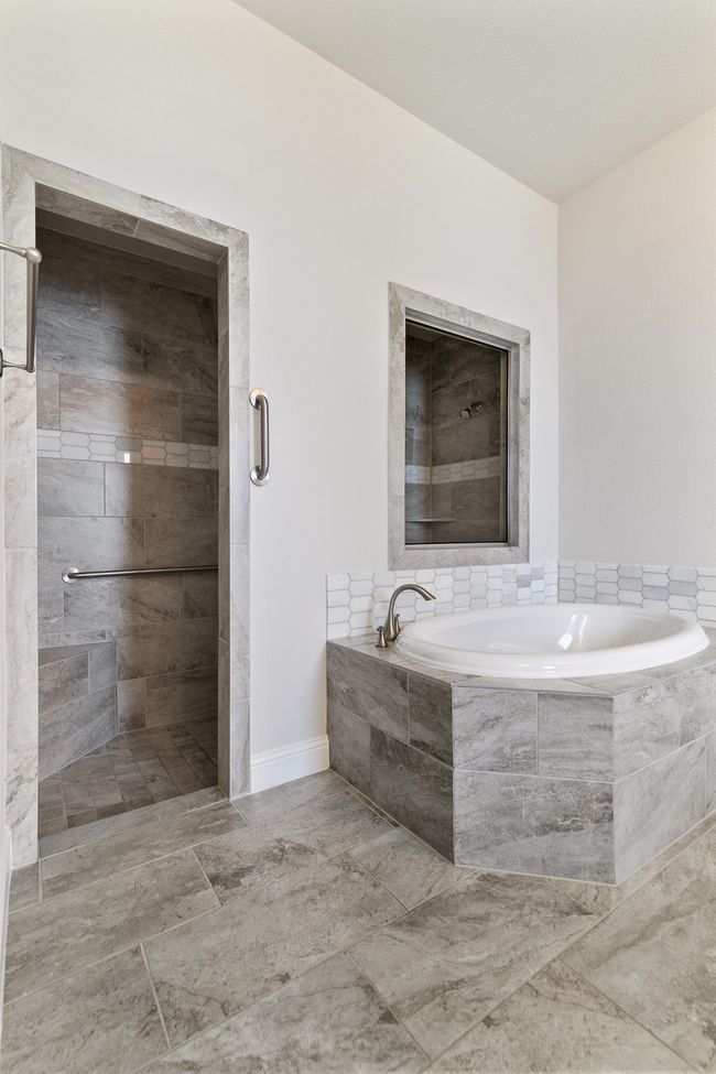 Bathroom with tiled shower and a garden tub | Image 19