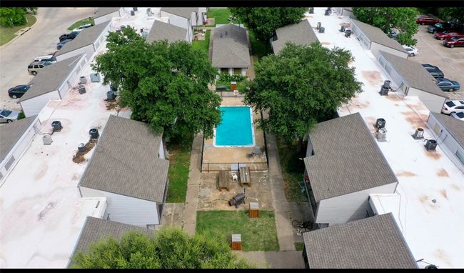 Aerial perspective of suburban area with a pool area | Image 8