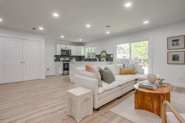 Living room with light wood-type flooring and recessed lighting | Image 5