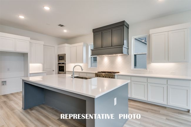 Style and sophistication abound in this dream kitchen! REPRESENTATIVE PHOTO. | Image 6