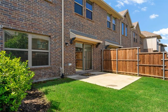 Back of house featuring a yard and a patio | Image 23